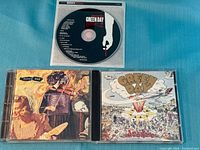 Front views of Insomniac and Dookie jewel cases with American Idiot disc