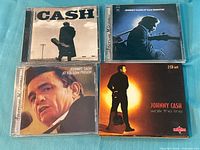 Front covers of four Johnny Cash CD cases