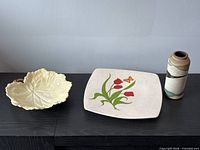 Overview of plate, bowl and vase on tabletop