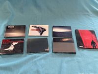 Front view of all seven CD cases laid out