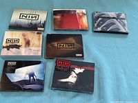 All seven CD cases front view