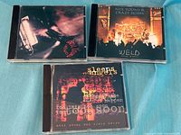 Front covers of three Neil Young CDs: Unplugged, Weld, Sleeps With Angels