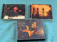 Front covers of three CD albums