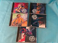 Front view of all five Time Life compilation CDs
