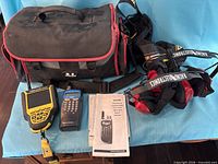 Lot overview showing both scanners, manual, bag, headsets and strap