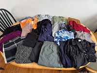 Overview of all 15 garments spread on table