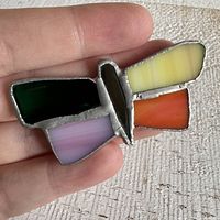 front view showing multicolour glass wings and body