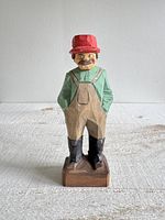 front view of carved farmer showing colors, missing pipe