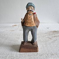 Front three-quarter view of Tom Hannah carved wood gentleman figurine