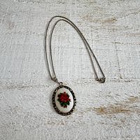 full view necklace laid flat showing pendant and chain