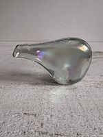 Side profile showing overall form and iridescence