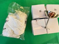 4 boxed goblets, one goblet displayed, sealed glove pack