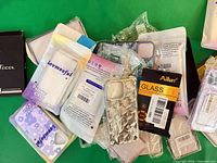 Group shot of all packaged cases and screen protectors