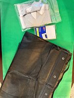 Overall lot showing black mesh organizer, sealed ankle supports bag, Avery labels pack