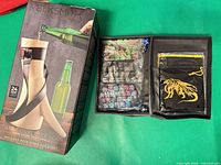 Retail box showing BLKSMITH Traditional Beer Horn, open compartment with dice and accessories