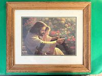 Front view of framed print showing artwork, mat, and wood-look frame