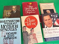 Six books laid out including Stand Ye in Holy Places and Investigating the Book of Mormon Witnesses
