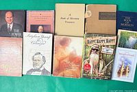 All eleven books laid out showing titles and condition