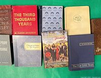 Group shot of nine books laid out showing most covers