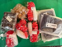 Group shot of all sealed packs: mats, chair leg protectors, cork pads, red rings