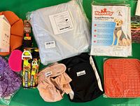 Overview of recovery vest, collars, garments, lick mat, grooming glove, jacket