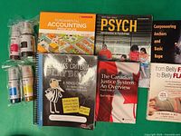 Overview of seven textbooks/workbooks and four sealed Epson 502 ink bottles
