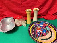 Group shot of all items: plate, cake mold, two dispensers, cake decorator