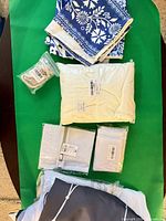 Assorted linens and mesh bags laid out