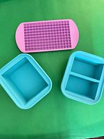 Three silicone molds displayed: cube grid, loaf, two-compartment