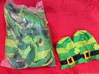 Bag containing multiple green felt leprechaun hats