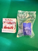 Both ornaments side by side, Tim Hortons boxed, Cineplex sealed