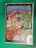 Full view of signed Willie Nelson cartoon poster in sleeve