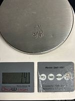 Chain on scale reading 1.4 g