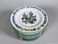 Stack of salad plates showing top floral design