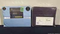 Two packaged queen sheet sets side by side