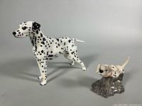 Both Dalmatian figurines side by side