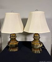 Front view of both brass lamps with shades
