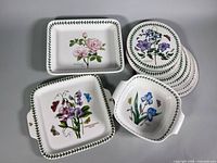 Four main items: three dishes and stack of eight placemats