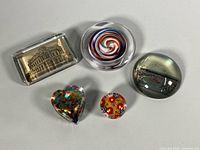 Group shot of all five paperweights