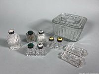 Group shot of all crystal shakers, covered dish and trays
