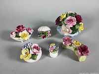 Group shot of all six bone-china floral figurines