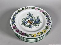 stack of eight Royal Worcester Herbs plates showing top decoration