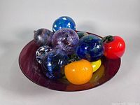 Bowl with balls and fruit