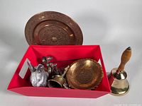 All items grouped in red bin plus brass school bell