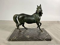Front left view of mare on marble base