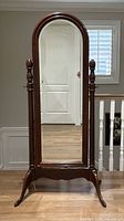 Front view of vintage Gibbard solid cherry arched cheval mirror with stand