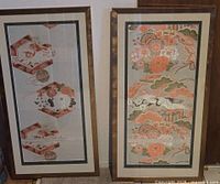 Two framed Japanese obi sash panels side by side