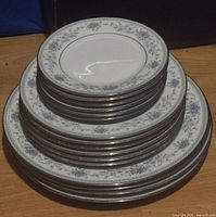 Stack showing all 16 Noritake Blue Hill plates in three sizes