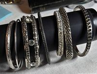 All six bangles displayed on bracelet bar