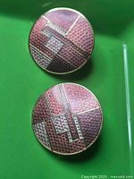 Front of both earrings showing enamel pattern and colors